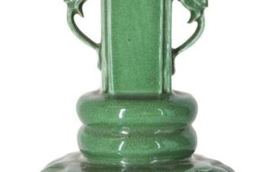 A Chinese monochrome porcelain apple-green crackle-glazed vase, 18th century, the lobed body topped with two bands rising to a straight neck with applied dragon handles, 21.6cm high Provenance: Private French collection