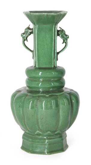 A Chinese monochrome porcelain apple-green crackle-glazed vase, 18th century, the lobed body topped with two bands rising to a straight neck with applied dragon handles, 21.6cm high Provenance: Private French collection