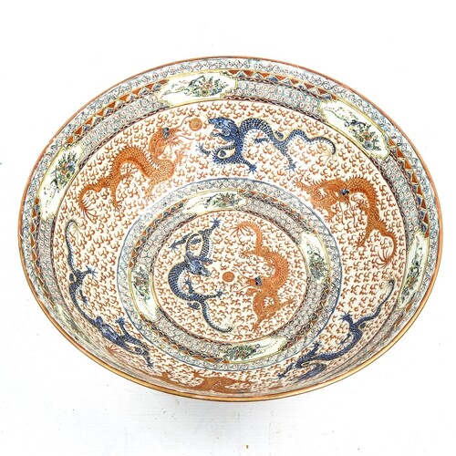 A Chinese porcelain dragon bowl, probably mid-20th century, ...
