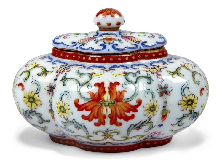 A Chinese porcelain famille rose lobed water pot and cover, the quadrilobed pot painted to the exterior with flowering lotus blooms amidst scrolling leafy stems, with additional flowerheads and small lotus blooms issuing from bands of ruyi lappets...