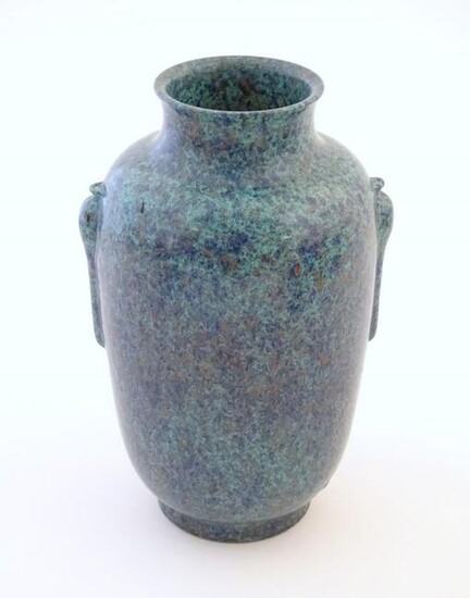 A Chinese vase with moulded twin handles and speckled