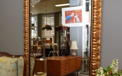 A DECORATIVE GILT SALON MIRROR (PLEASE NOTE THIS ITEM MUST BE REMOVED BY CLIENTS OR CARRIERS AT THE CUSTOMERS EXPENSE.)