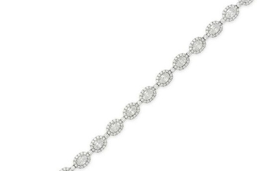 A DIAMOND BRACELET in 18ct white gold, comprising a row of oval cut diamonds in clusters of round