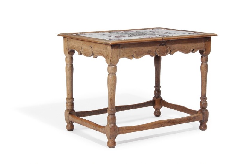 A Danish 20th century Baroqu style oak table, top with 24 Dutch 19th century faiance tiles. H. 88. L. 89. W. 63 cm.