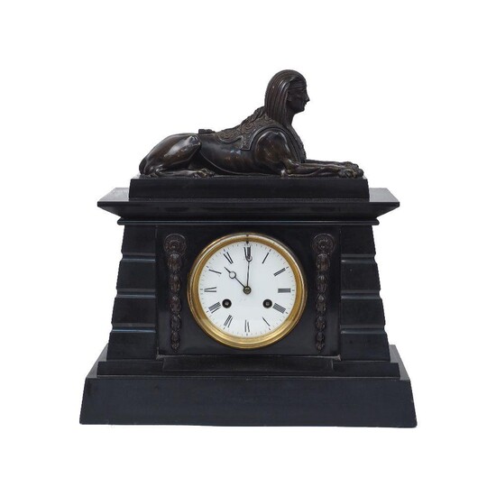 A French bronze and marble mantel clock, early 20th century, in the Egyptian revival manner, the architectural case surmounted by a sphinx, 38cm high, 36cm wide, 16cm deep Please note that Roseberys do not guarantee working order or time keeping of...