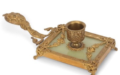 A French ormolu and onyx chamber stick, circa 1900, with rel...