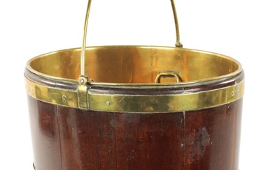 A GEORGE III OVAL MAHOGANY BRASS BOUND OYSTER BUCKET...