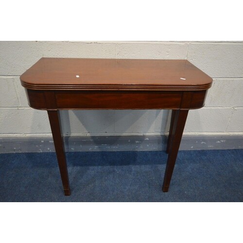 A GEORGIAN MAHOGANY FOLD OVER TEA TABLE with rounded and ree...