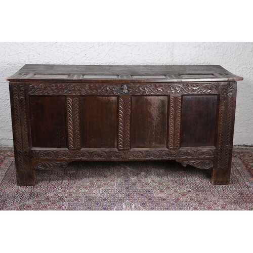 A GOOD GEORGIAN AND CARVED OAK COFFER the rectangular hinged...