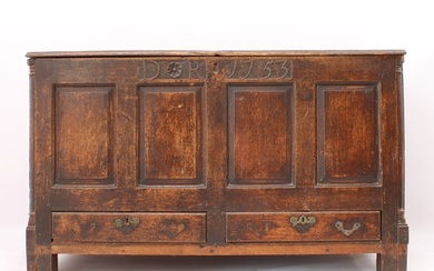 A George II oak mule chest - the boarded top with thumb-moul...