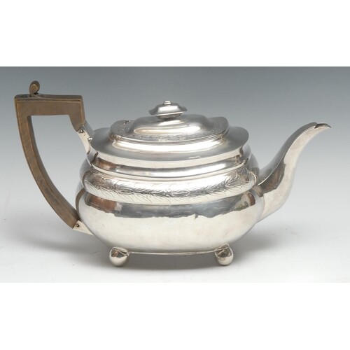 A George III silver boat shaped teapot, hinged domed cover, ...