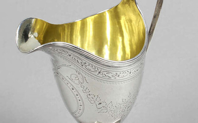 A George III silver cream jug by Peter & Ann Bateman.