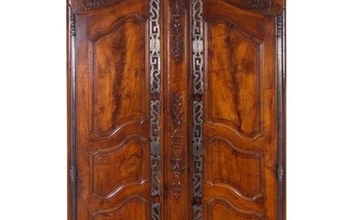 A Louis XV Provincial Carved Walnut Armoire