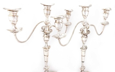 A PAIR OF SILVER-PLATED CANDELABRA by Barker Brothers Silver...