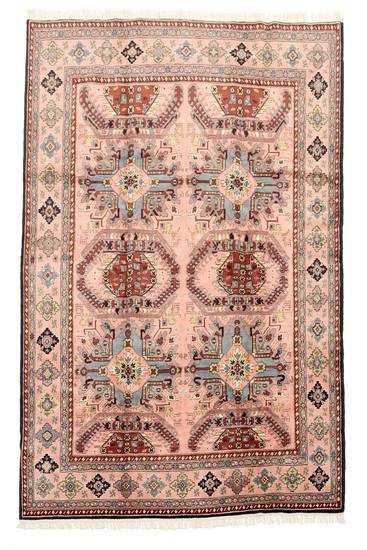 A Persian Ardebil carpet, classical Kazak design with ornaments on rose base. 20th century. 289×198 cm.