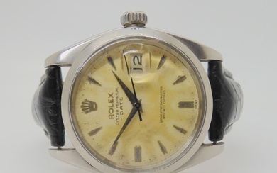 A ROLEX OYSTER PERPETUAL DATE with cream patinaed dial, dagg...