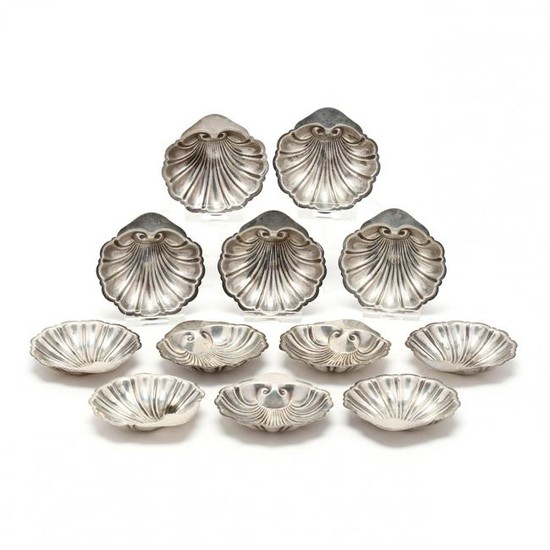 A Set of Twelve Sterling Silver Shell Form Butter Pats