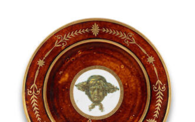 A Sèvres tortoiseshell-ground plate with mask of Apollo, circa 1803-05