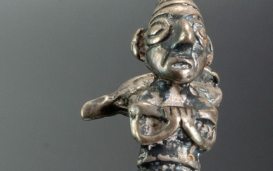 A Silver Miniature Figurine Showing a Walking Man carrying a Bundle, Chimu Inca, Peru, 1470-1534 CE