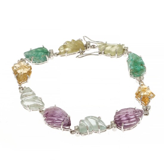 A Tutti Frutti bracelet set with carved emerald, aquamarine, amethyst and citrine, and numerous brilliant-cut diamonds, mounted in 14k white gold.