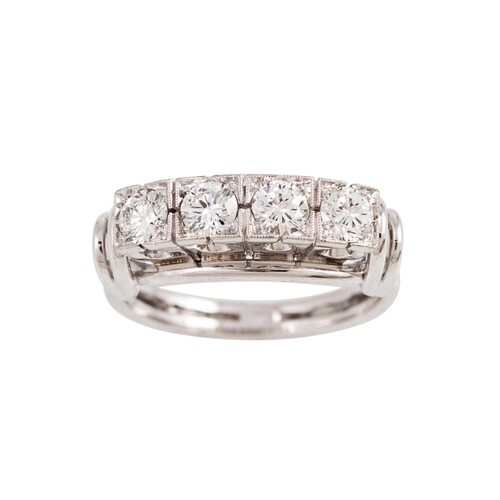 A VINTAGE DIAMOND FOUR STONE RING, the brilliant cut diamond...