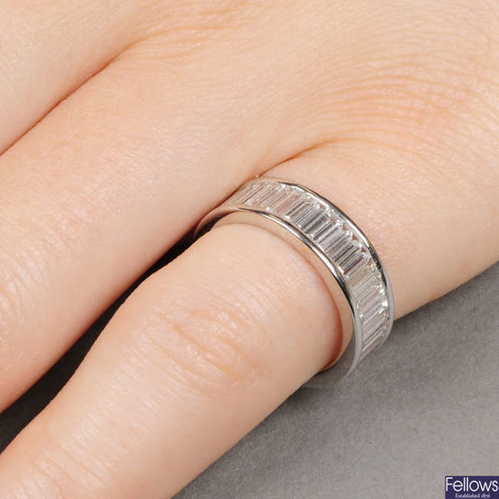 A baguette-cut diamond full eternity ring.Estimated