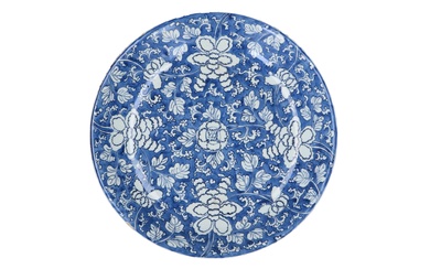 A blue and white porcelain dish decorated with flowers. Marked with artemisia leaf in double circle, China Kangxi. Diam. 38.5 cm.