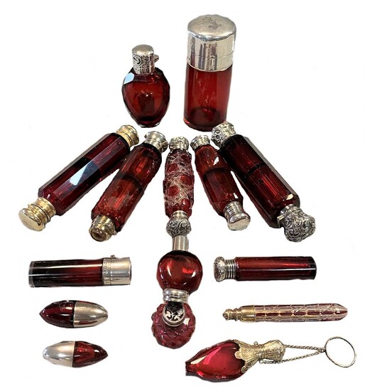 A collection of Victorian and later red glass scent bottles