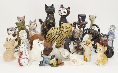 A collection of assorted decorative cats, to include; pottery, wood, plaster and plastic examples, of varying sizes and designs, tallest 27cm high (lot)