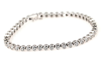A diamond bracelet set with numerous brilliant-cut diamonds, mounted in 14k white...