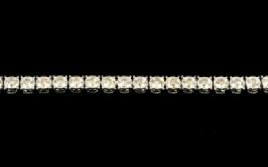A diamond set 9ct white gold tennis bracelet, comprising forty...