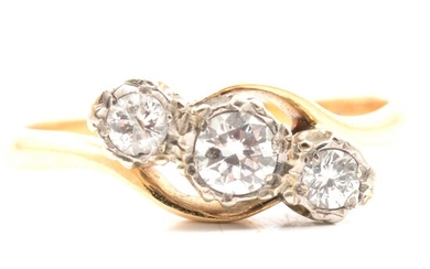 A diamond three stone crossover ring.
