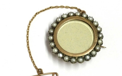 A gold and silver, split pearl set brooch