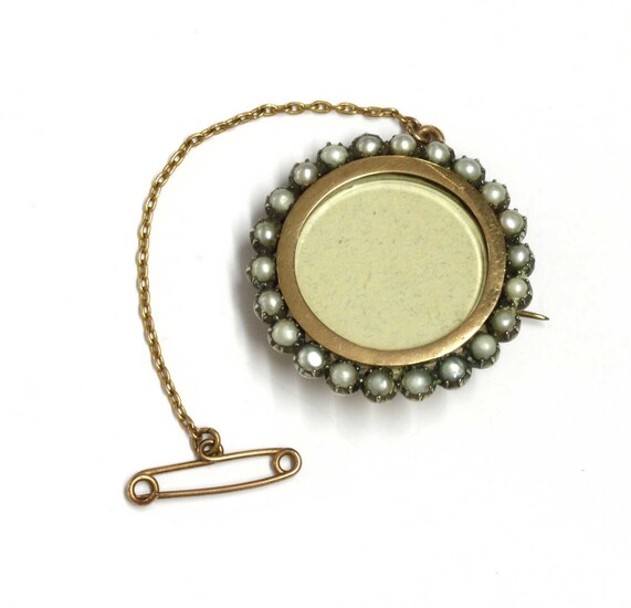 A gold and silver, split pearl set brooch