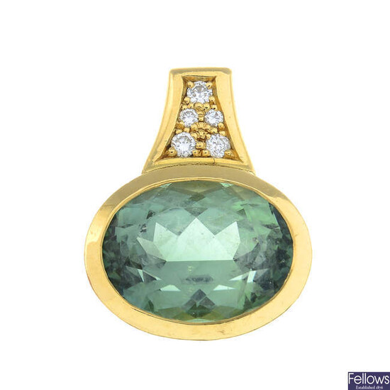 A green tourmaline and diamond pendant.