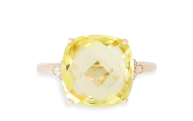 A greenish yellow quartz, diamond and fourteen karat gold ring