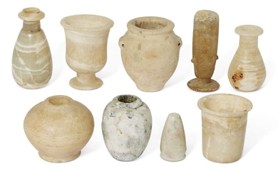 A group of Antiquities comprising four small Egyptian alabaster vessels Middle Kingdom-Ptolemaic Period, circa 1750-30 B.C., including a cylindrical-bodied ointment jar with disc lid, 5.6cm high; a bulbous jar with narrow neck, tapering to the...