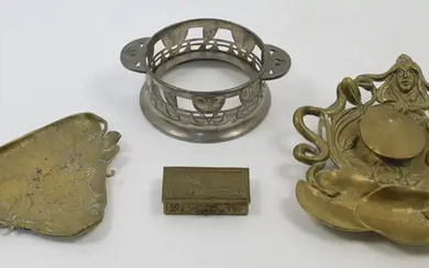 A group of Art Nouveau metalwares, comprising a brass inkwell with maiden's...