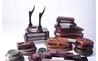 A group of Chinese carved hardwood vase and curio stands