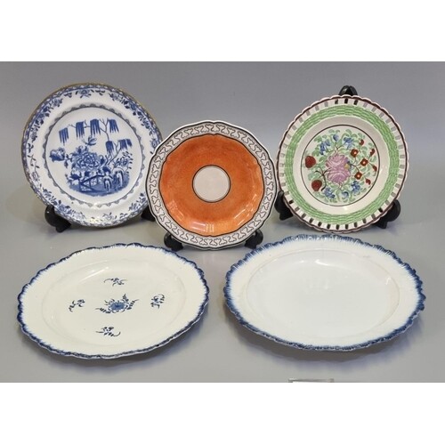 A group of Welsh pottery plates to include; a orange ground ...