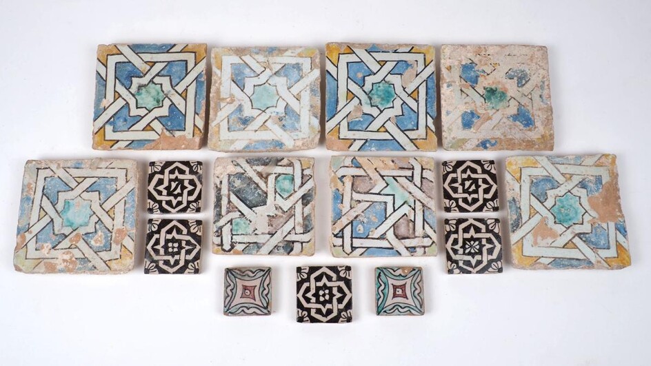 A group of tiles, Persia, 18th century, all hand-painted, in varying designs and sizes, all hand-painted in slip and glaze, of typical colourway, comprising; six of one pattern, 12.5cm x 12.5cm, two of another pattern, 11cm x 11cm, five of another...