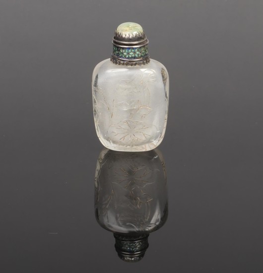 A late 19th century Chinese carved rock crystal snuff bottle...