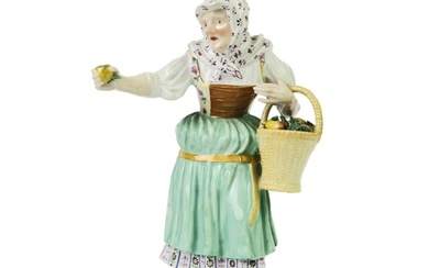 A late 19th century Meissen porcelain figure of an apple sel...