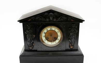 A late 19th/early 20th century slate mantel clock with figural...