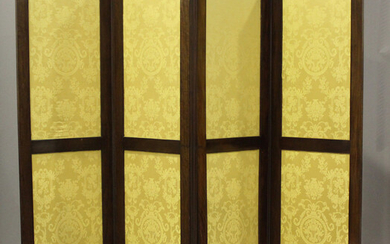 A late Victorian mahogany framed four-fold screen, inset with panels of patterned yellow damask, hei