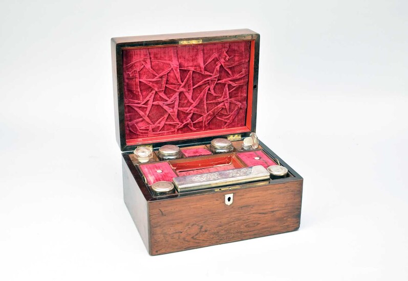 A late Victorian rosewood travelling dressing table set