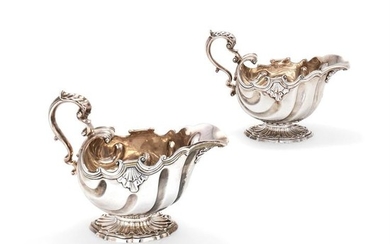 A matched pair of George II and late George III oval sauce boats