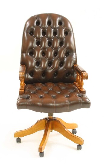 A modern buttoned leather upholstered high back office chair