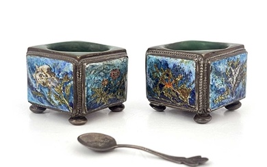 A pair of Arts and Crafts enamelled and silver plated salt c...