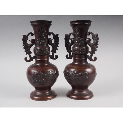 A pair of Chinese bronze vases with dragon handles